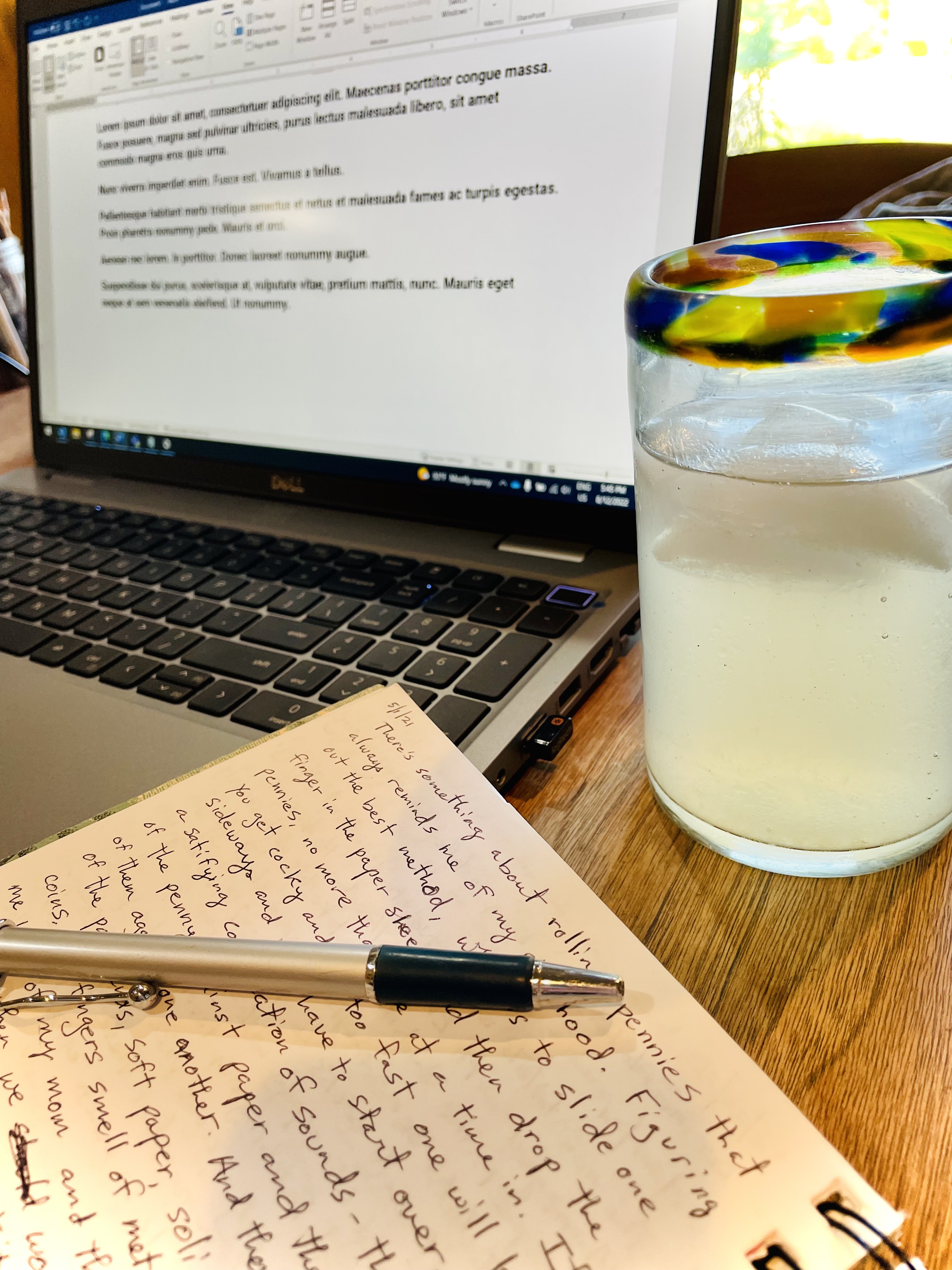 computer and notepad and lemonade